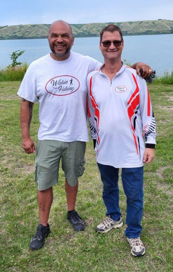 Steven Gloade and David Gillis at the third annual Wishin' I was Fishin' event at Echo Lake, Saskatchewan, July 30, 2022. (Lee Harding/The Epoch Times)