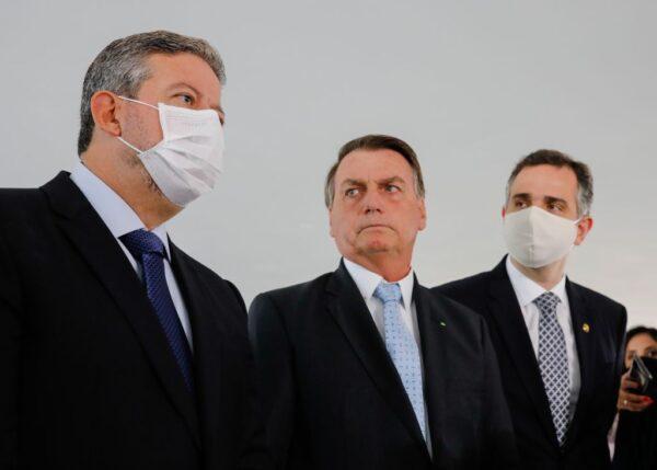 Brazilian President Jair Bolsonaro (C), president of the Chamber of Deputies, Arthur Lira (L), and president of the Federal Senate, Rodrigo Pacheco, offer a press conference at Planalto Palace in Brasilia, Brazil, on Feb. 3, 2021. (Sergio Lima/AFP via Getty Images)