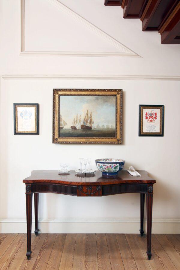 In the Great Stair Hall hangs a seascape by Richard Paton titled “English Frigate ‘America.’” (Courtesy of Tryon Palace)