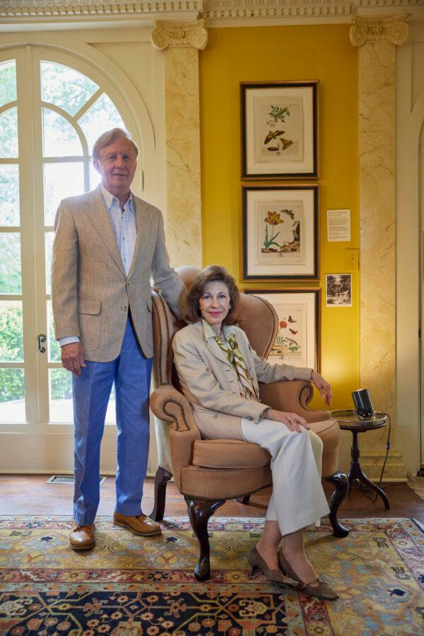Gilbert Johnston and Linda Faulkner Johnston at the entry hall of their home, in front of decorative prints from “The Aurelian” by Moses Harris. ( Imaginary Lines, Mary Brandt Photography)