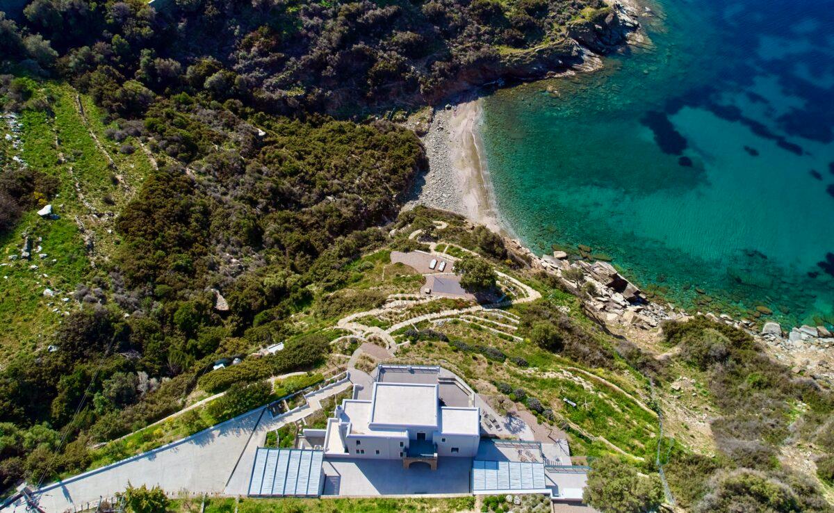  An aerial view of Sappho reveals the exclusive seafront estate on the aquamarine Aegean. Situated at the extreme north end of Paros Island, the property is in close proximity to the picturesque village of Naoussa. (Courtesy of Greece Sotheby's International Realty)
