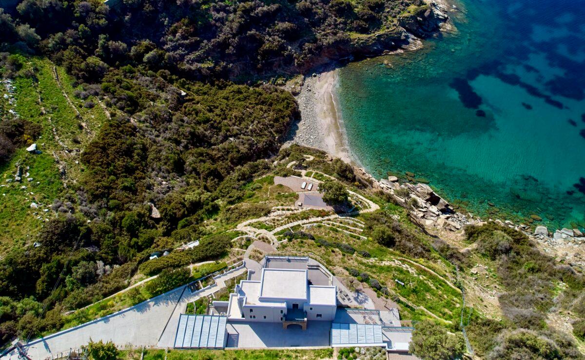 An aerial view of Sappho reveals the exclusive seafront estate on the aquamarine Aegean. Situated at the extreme north end of Paros Island, the property is in close proximity to the picturesque village of Naoussa. (Courtesy of Greece Sotheby's International Realty)