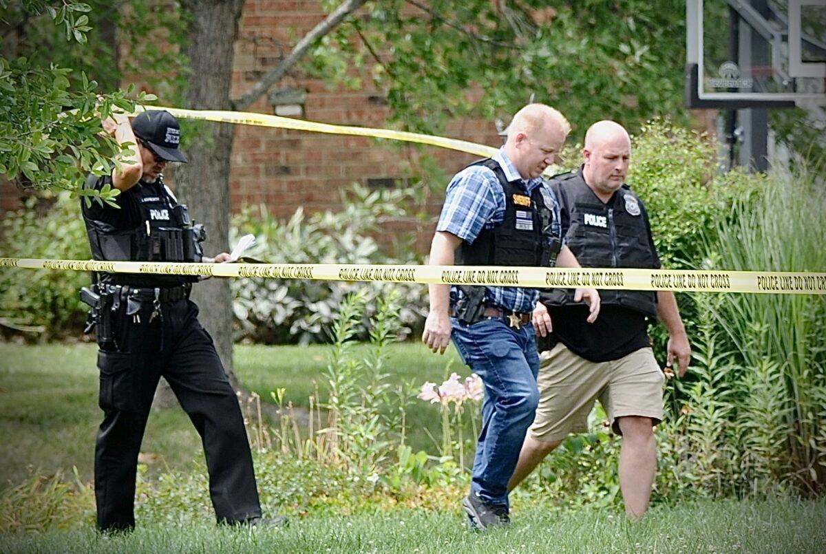 Police investigate a shooting in Butler Township, Ohio, on Aug. 5, 2022. (Marshall Gorby/Dayton Daily News via AP)