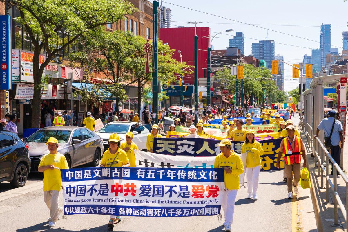 Hundred of people march in a parade in downtown Toronto on Aug. 6, 2022, to celebrate 400 million Chinese people quitting the Chinese Communist Party and its affiliated organizations. (Evan Ning/The Epoch Times)