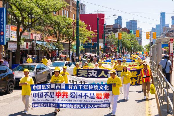 Falun Gong adherents take part in a parade through Chinatown in downtown Toronto on Aug. 6, 2022, to celebrate 400 million Chinese people quitting the Chinese Communist Party and its affiliated organizations. (Evan Ning/The Epoch Times)
