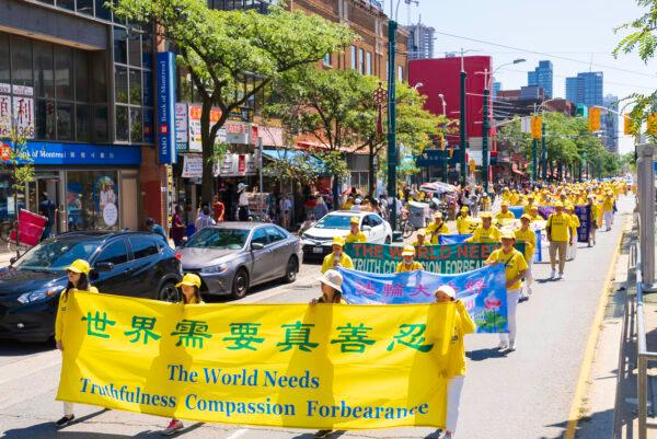 Hundred of people march in a parade in downtown Toronto on Aug. 6, 2022, to celebrate 400 million Chinese people quitting the Chinese Communist Party and its affiliated organizations. (Evan Ning/The Epoch Times)
