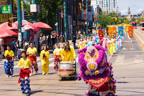 Traditional Chinese drum and lion dance performances are part a parade in downtown Toronto to celebrate 400 million Chinese people quitting the Chinese Communist Party and its affiliated organizations, on Aug. 6, 2022,. (Evan Ning/The Epoch Times)