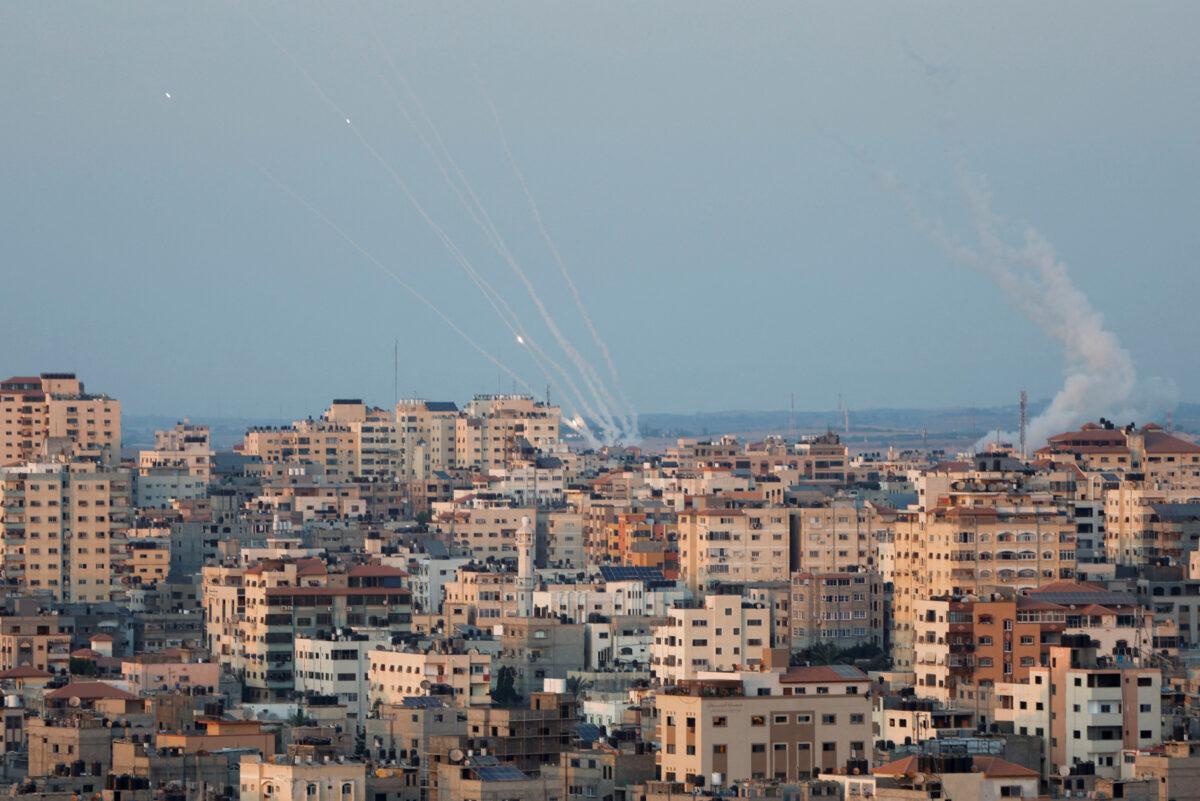 Rockets are launched by Palestinian terrorists into Israel, in Gaza, on Aug. 7, 2022. (Mohammed Salem/Reuters)