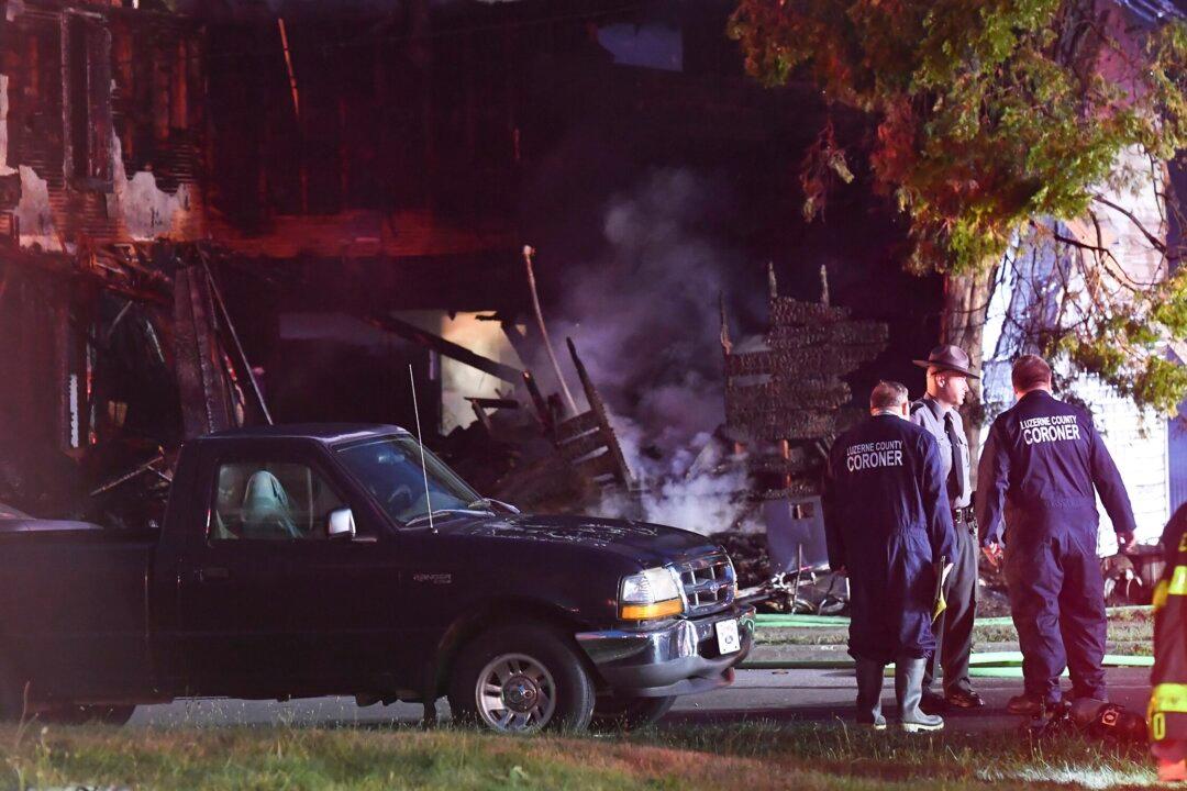 Coroner: Smoke Inhalation Killed at Least 5 of 10 in Fire