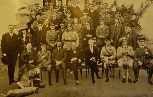 Cairo Conference March 1921. Bell was the only woman invited to the 1921 Cairo Conference, where British officials met to discuss the eventual makeup of the region. Seated (4th from L): Winston Churchill. Standing: (4th from right)  T. E. Lawrence ("Lawrence of Arabia"); (2nd from right) Gertrude Bell. (Public Domain)