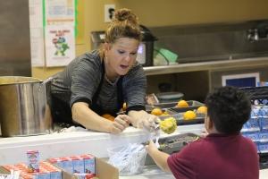 A cafeteria worker serves lunch to a student at Grant Park Christian Academy in May 2022. (Courtesy of Grant Park Christian Academy)