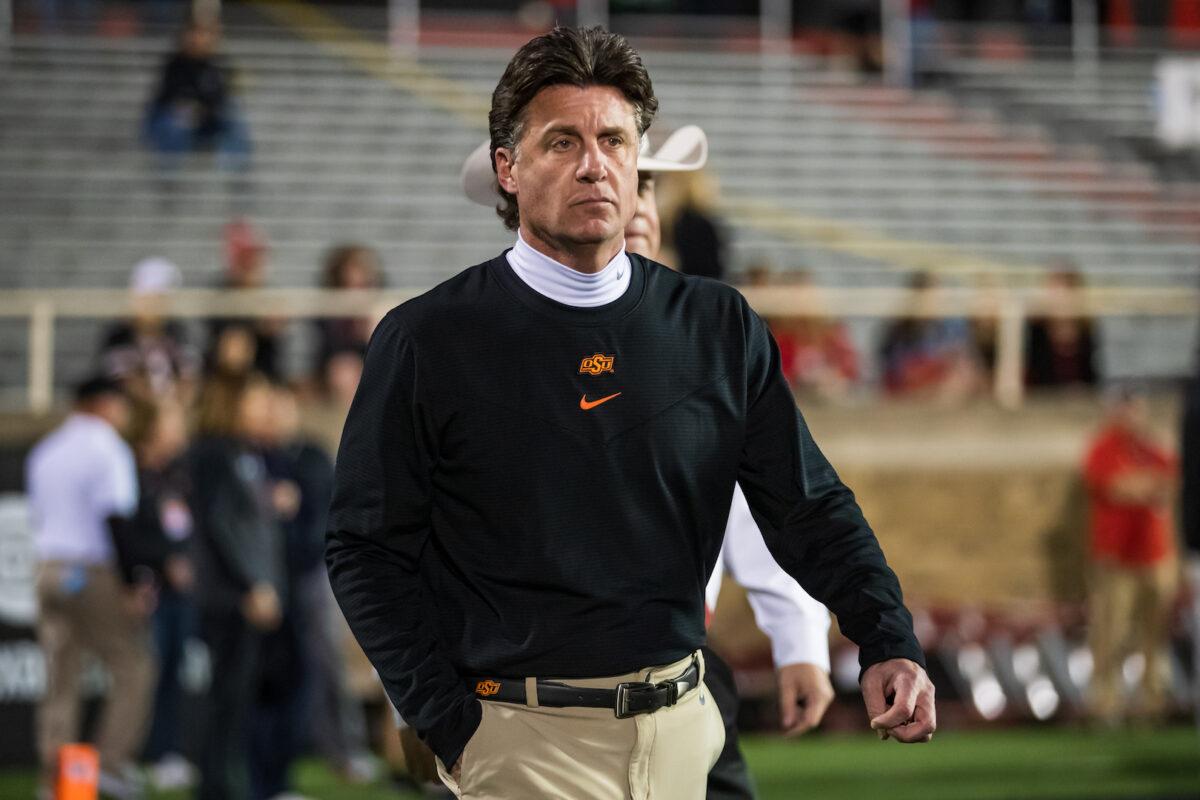 Head coach Mike Gundy of the Oklahoma State Cowboys walks onto the field before the college football game against the Texas Tech Red Raiders at Jones AT&T Stadium in Lubbock, Texas, on Nov. 20, 2021. (John E. Moore III/Getty Images)