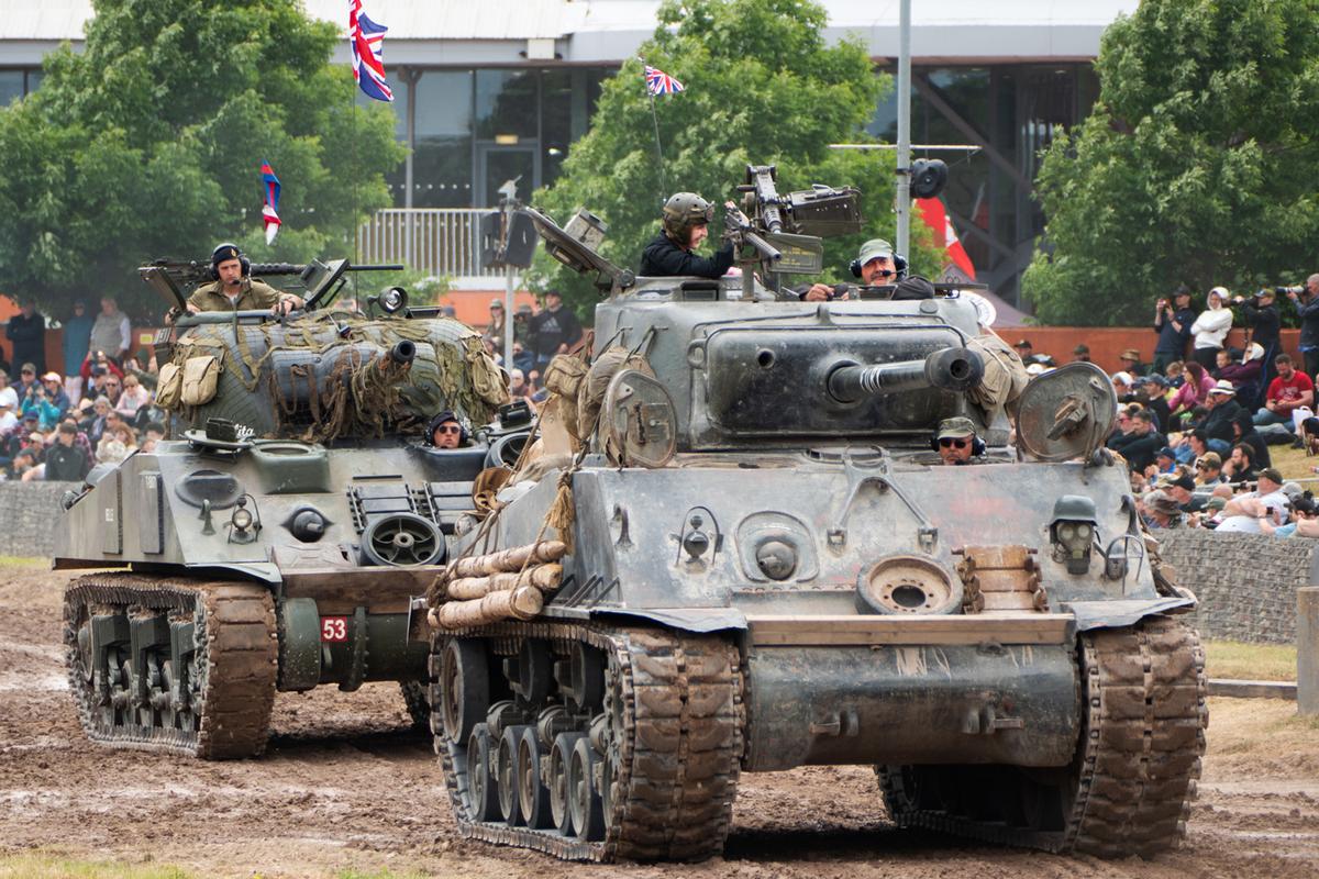 Sherman Tanks, led by the tank that played Fury in the movie of that title, take the field during the annual Tankfest event at the Tank Museum in Bovington, England. (Alan Behr/TNS)