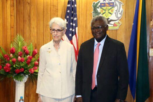 This picture taken on Aug. 7, 2022, shows US Deputy Secretary of State Wendy Sherman posing for pictures with the Solomon Islands Prime Minister Manasseh Sogavare (R) after a ceremony to mark the 80th Anniversary of the Battle of Guadalcanal at Skyline Ridge in Honiara, Solomon Islands. (Mavis Podokolo/AFP via Getty Images)