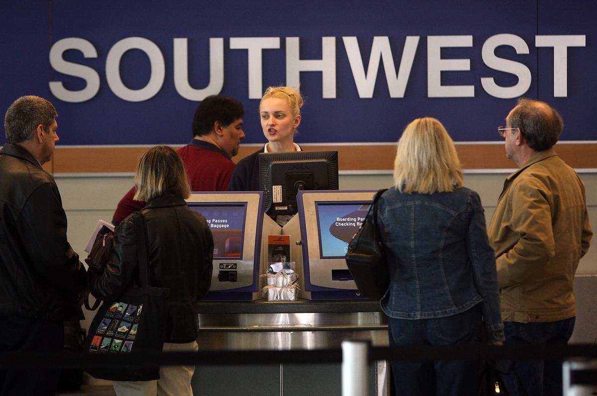 Southwest Airlines passengers check in at Chicago Midway International Airport in a file photo. (Scott Olson/Getty Images)