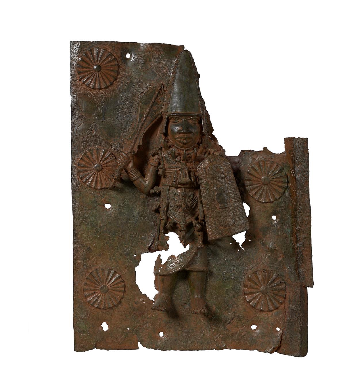 A brass plaque depicting Agban, the Ezomo (deputy commander in chief of the Benin army), toward the end of the reign of Oba Orhogbua (circa 1550–1578) and the start of the reign of Oba Ehengbuda (circa 1578–1608). (Courtesy of Horniman Museum and Gardens via AP)