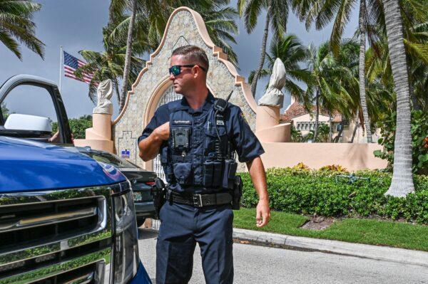 A local law enforcement officer in front of the home of former President Donald Trump at Mar-A-Lago in Palm Beach, Fla., on Aug. 9, 2022. (Giorgio Viera/AFP via Getty Images)