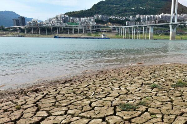 A dried riverbed is exposed after the water level dropped in the Yangtze River in Yunyang county in southwest China's Chongqing Municipality, on Aug. 16, 2022. (Chinatopix/AP)