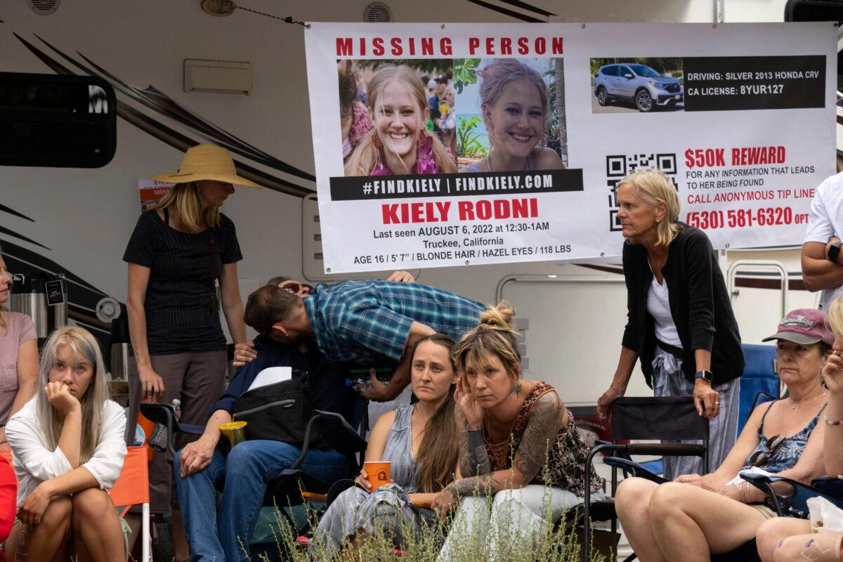 Lindsey Rodni-Nieman (C), mother of missing 16-year-old Kiely Rodni, listens to law enforcement during a news conference in Truckee, Calif., on Aug. 9, 2022. (Paul Kitagaki Jr./The Sacramento Bee via AP)