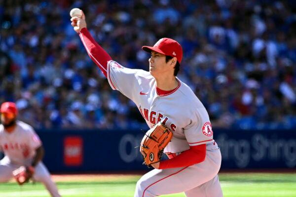 Los Angeles Angels starting pitcher Shohei Ohtani throws to a Toronto Blue Jays batter during the first inning of a baseball game in Toronto, Canada, August 27, 2022. (Jon Blacker/The Canadian Press via AP)