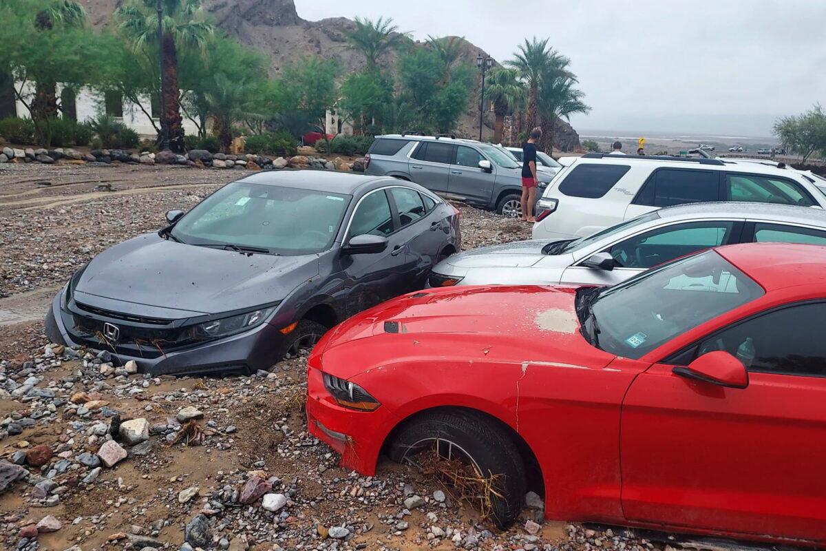  Cars are stuck in mud and debris from flash flooding at The Inn at Death Valley in Death Valley National Park, Calif., on Aug. 5, 2022. (National Park Service via AP)