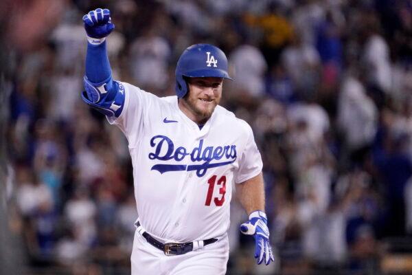 Los Angeles Dodgers' Max Muncy gestures as he rounds their after hitting a three-run home run during the fifth inning of a baseball game against the San Diego Padres in Los Angeles, Aug. 6, 2022. (Mark J. Terrill/AP Photo)