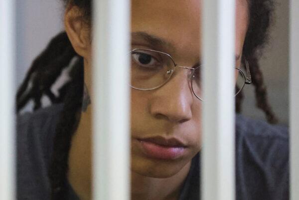 U.S. basketball player Brittney Griner, who was detained at Moscow's Sheremetyevo airport and later charged with illegal possession of cannabis, sits inside a defendants' cage before the court's verdict in Khimki outside Moscow, Russia, on Aug. 4, 2022. (Evgenia Novozhenina/Pool/Reuters)