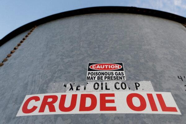 A sticker reads "CRUDE OIL" on the side of a storage tank in the Permian Basin in Mentone, Loving County, Texas, on Nov. 22, 2019. (Reuters/Angus Mordant)