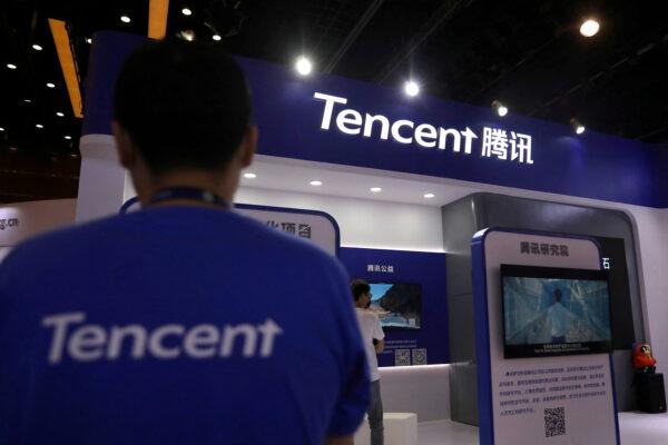 A staff member is seen at a booth of Tencent at an exhibition during China Internet Conference in Beijing, China, July 13, 2021. (Tingshu Wang/ Reuters)