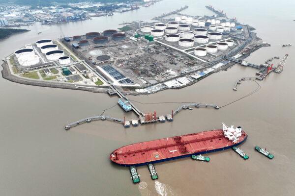 An aerial view shows tugboats helping a crude oil tanker to berth at an oil terminal off Waidiao Island in Zhoushan, Zhejiang Province, China, on July 18, 2022. (CNS photo via Reuters)