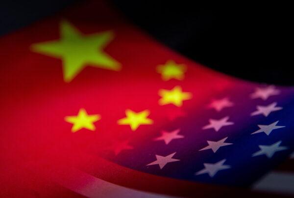 The flags of China and the United States are seen printed on paper in this illustration taken on Jan. 27, 2022. (Dado Ruvic/Reuters)