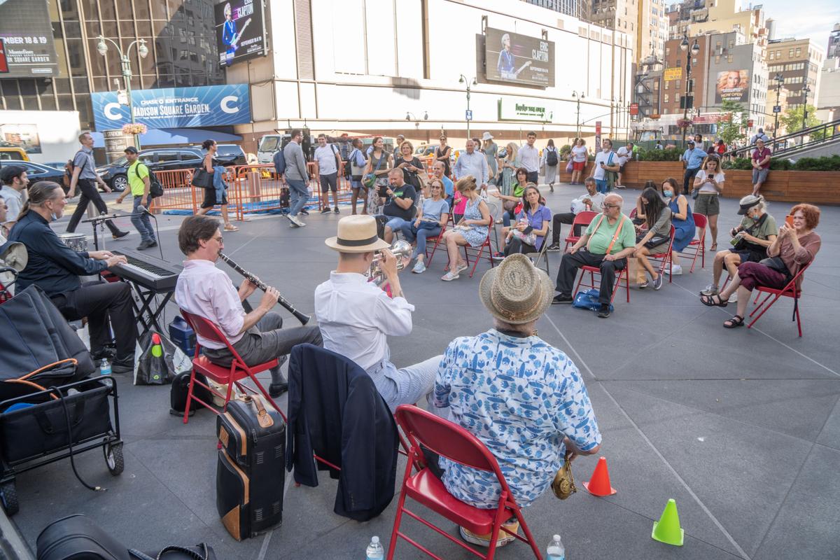It may not be Madison Square Garden, but it’s across the street. The Gotham City Band performs a free concert for New Yorkers. (Dave Paone/The Epoch Times)