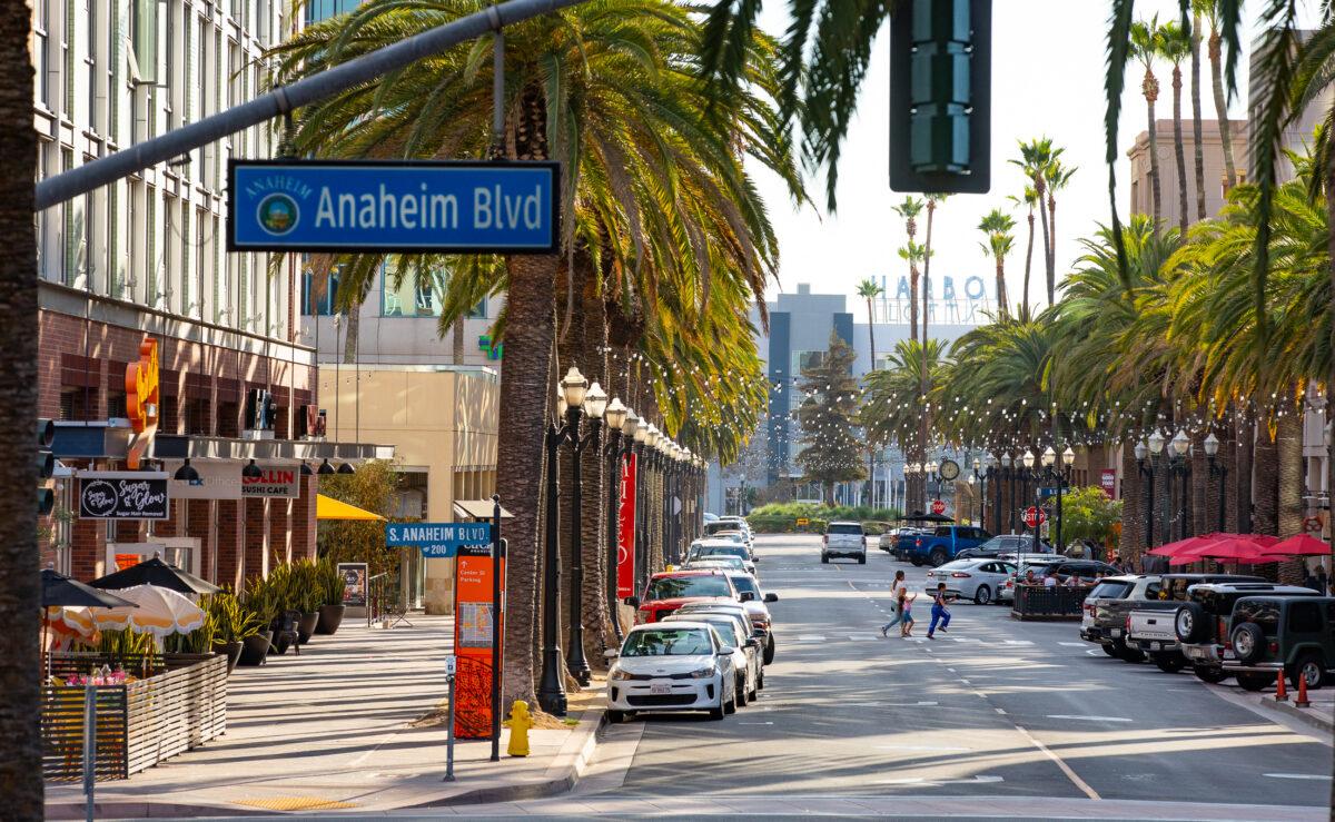 People walk near Anaheim City Hall in Anaheim, Calif., on Aug. 9, 2022. (John Fredricks/The Epoch Times)