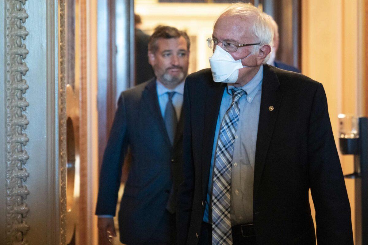 (L-R) Sen. Ted Cruz (R-Texas) and Sen. Bernie Sanders (I-Vt.) leave the Senate Chamber after final passage of the Inflation Reduction Act at the U.S. Capitol in Washington on Aug. 7, 2022. (Drew Angerer/Getty Images)