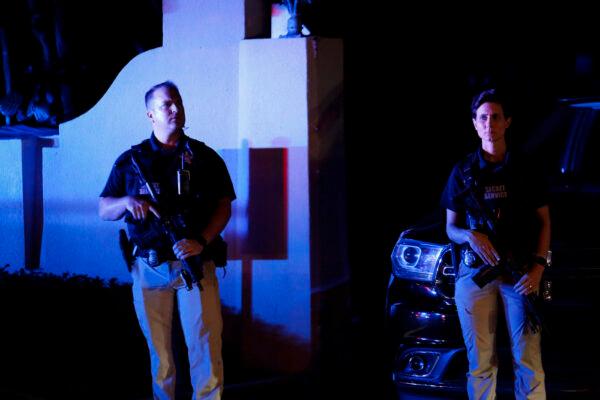 Secret Service personnel are seen in front of the home of former President Donald Trump at Mar-A-Lago in Palm Beach, Fla. on August 8, 2022. The FBI raided the home reportedly to retrieve classified White House documents. (Eva Marie Uzcategui/Getty Images)