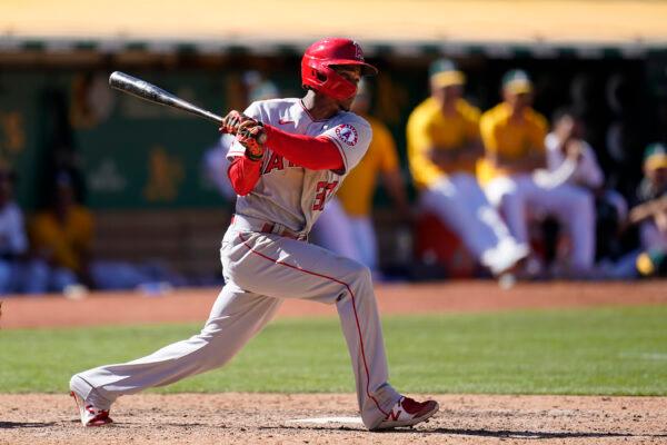 Los Angeles Angels' Magneuris Sierra watches his RBI double during the twelfth inning of a baseball game against the Oakland Athletics in Oakland, Calif., Aug. 10, 2022. (Jeff Chiu/AP Photo)