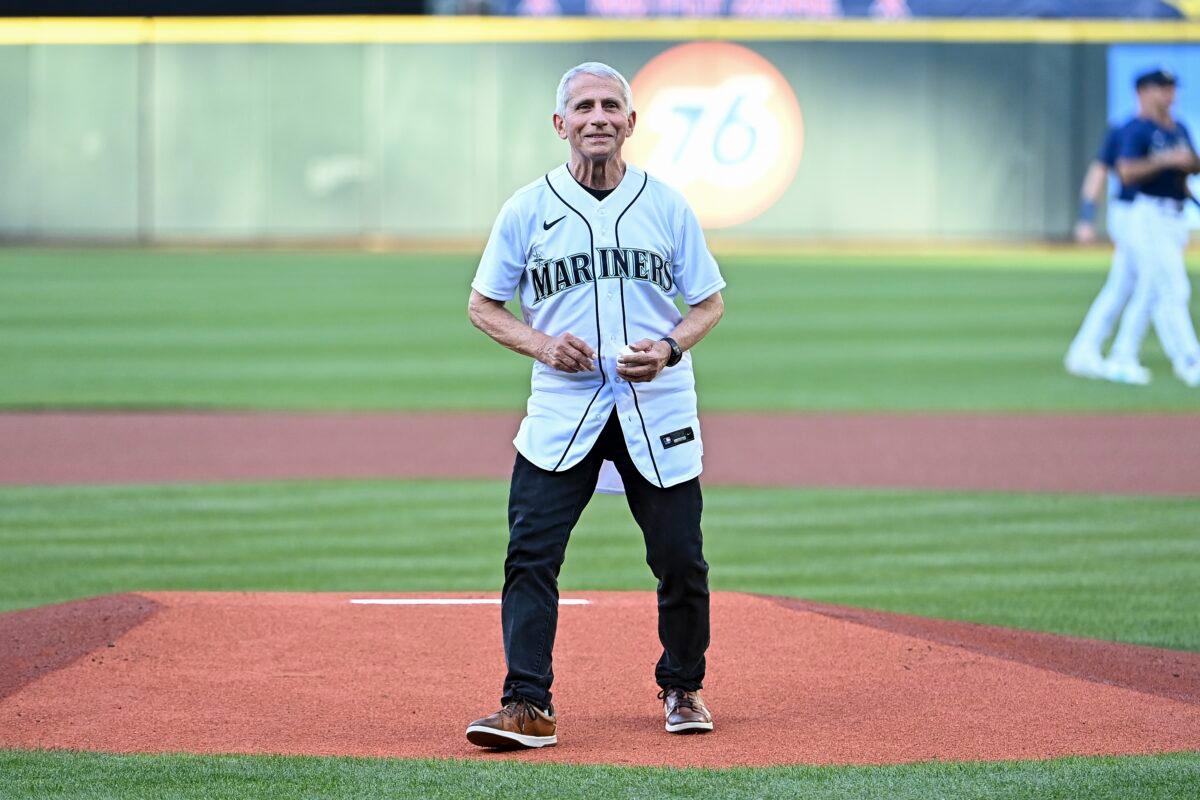 Dr. Anthony Fauci, director of the National Institute of Allergy and Infectious Diseases and chief medical adviser to U.S. President Joe Biden, throws a pitch before the game between the Seattle Mariners and the New York Yankees at T-Mobile Park in Seattle, Wash., on Aug. 9, 2022. (Alika Jenner/Getty Images)