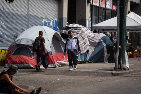 Tents line the sidewalk on East Hastings Street as the city works to clear tents from a sprawling homeless encampment in the Downtown Eastside of Vancouver, on Aug. 9, 2022. (Darryl Dyck/The Canadian Press)