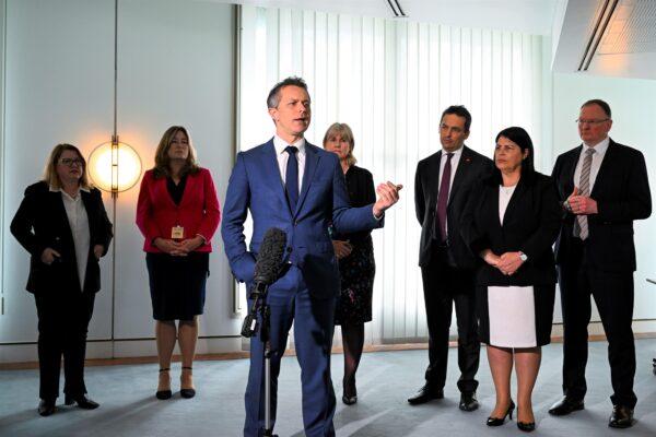 Australian Education Minister Jason Clare, together with state and territory counterparts, speak to the media after a meeting at Parliament House in Canberra, Australia, on Aug. 12, 2022. (AAP Image/Lukas Coch)