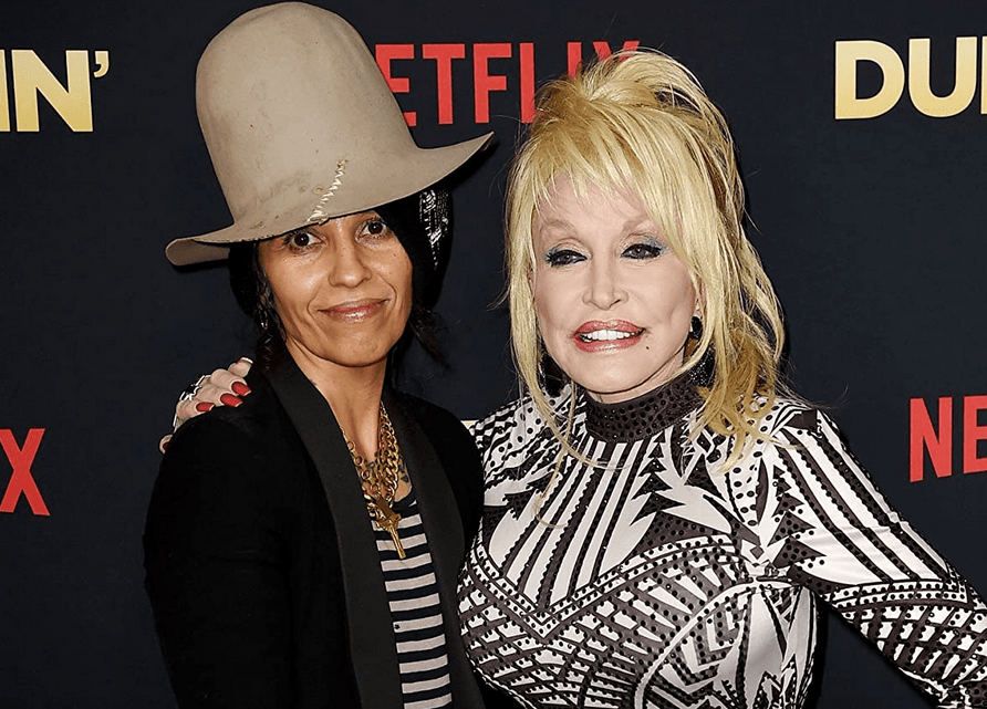Linda Perry (L) and Dolly Parton at an event, in "Dolly Parton: Here I Am." (British Broadcasting Corporation)