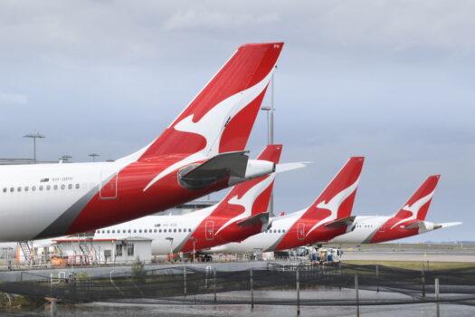 A line of Qantas aircraft sits at Kingsford Smith Airport in Sydney, Australia, on Oct. 31, 2021. (James D. Morgan/Getty Images)