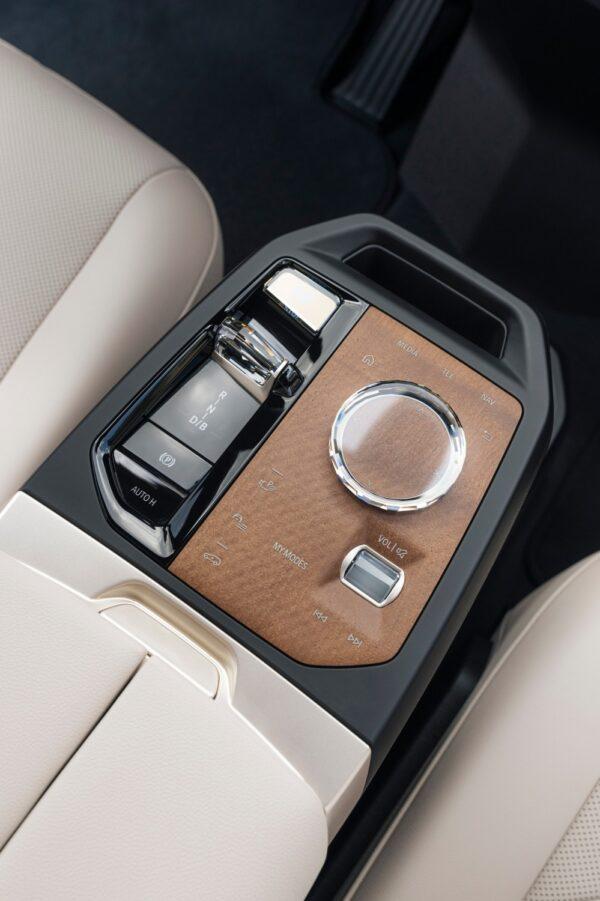 Center console with wood trim and glass controls. (Courtesy of BMW)