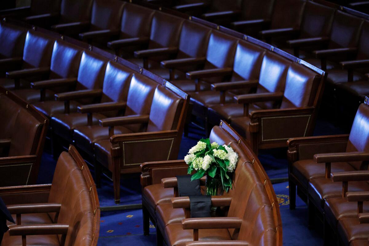 Black bunting and white flowers are laid on a seat on the floor of the House of Representatives in memorial of Rep. Jackie Warlorski (R-Ind.) at the U.S. Capitol in Washington on Aug. 12, 2022. (Chip Somodevilla/Getty Images)