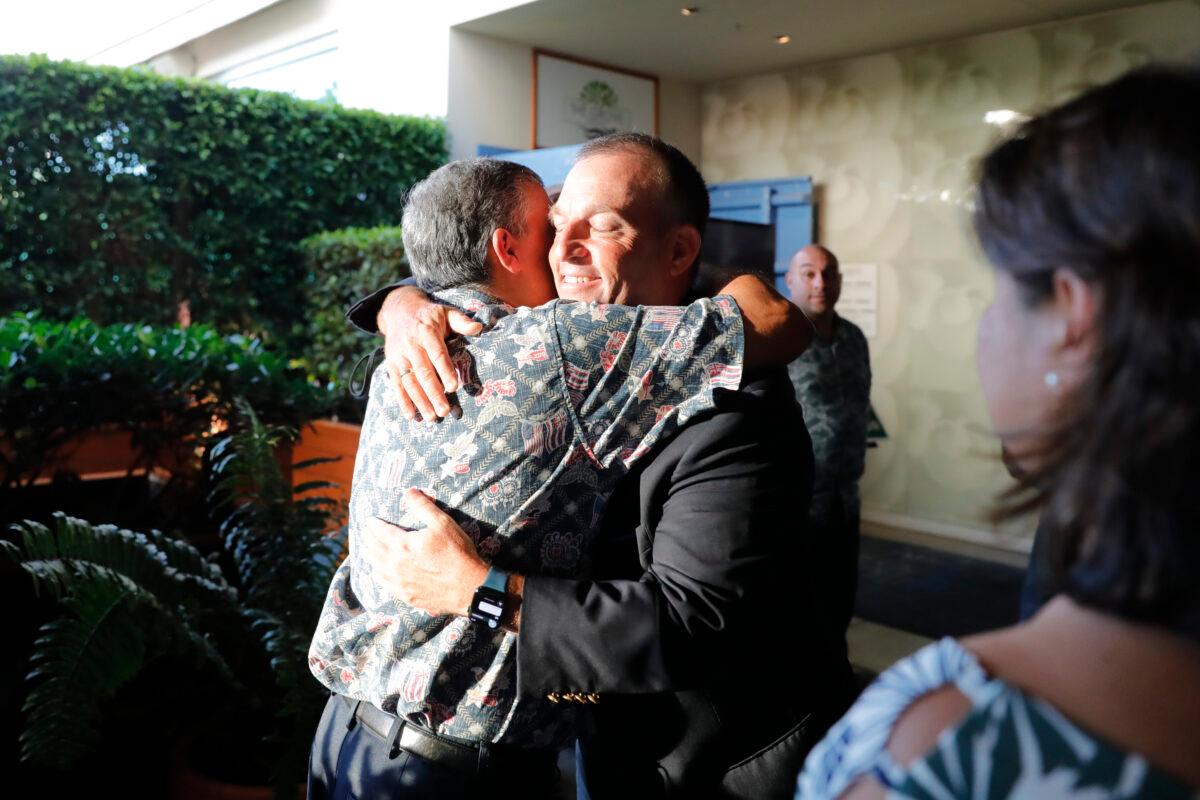 Democratic gubernatorial candidate Josh Green (C R) embraces a supporter at his campaign headquarters inside the Modern Hotel in Honolulu on Aug. 13, 2022. (Jamm Aquino/Honolulu Star-Advertiser via AP)