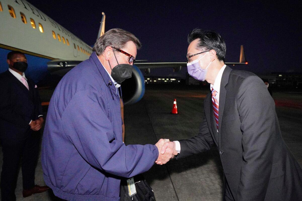Taiwan's Foreign Ministry Department of North American Affairs Director-General Douglas Hsu (R) welcomes U.S. Rep. John Garamendi (D-Calif.) at Songshan Airport in Taipei, Taiwan, on Aug. 14, 2022. (Taiwan Ministry of Foreign Affairs/Handout via Reuters)