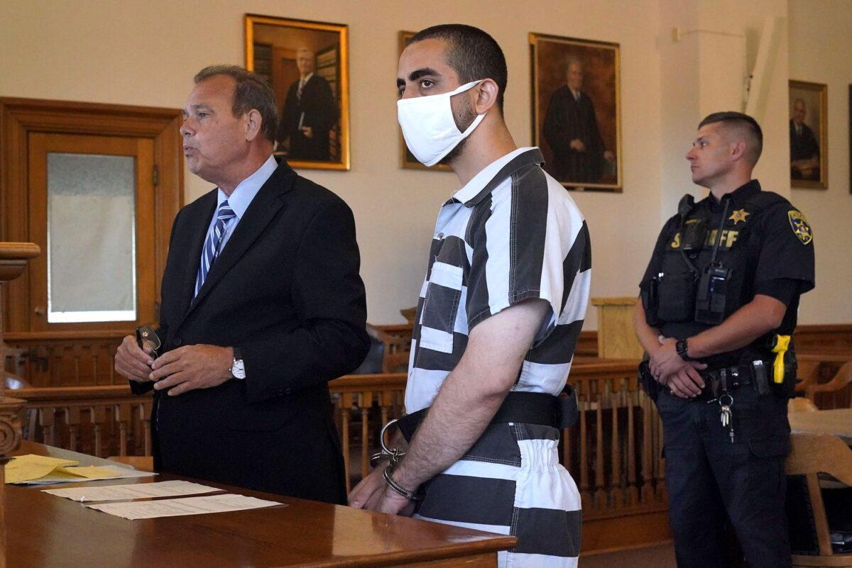 Hadi Matar, who allegedly stabbed author Salman Rushdie, listens as his public defense attorney (L) addresses the judge in the Chautauqua County Courthouse in Mayville, N.Y., on Aug. 13, 2022. (Gene J. Puskar/AP Photo)