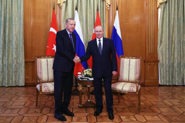 Russian President Vladimir Putin (R) shakes hands with Turkish President Recep Tayyip Erdogan (L) during a meeting in Sochi, Russia, on Aug. 5, 2022. (Vyacheslav Prokofyev/AFP via Getty Images)