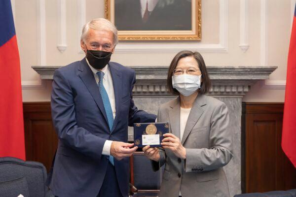 Taiwan's President Tsai Ing-wen (R) exchanges gift with U.S. Sen. Ed Markey (D-Mass.) during a meeting at the Presidential Office in Taipei, Taiwan on Aug. 15, 2022. (Taiwan Presidential Office via AP)