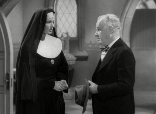 Ingrid Bergman as Sister Benedict discusses a generous donation with Henry Travers as Horace Bogardus in "The Bells of St. Mary's." (RKO Pictures)