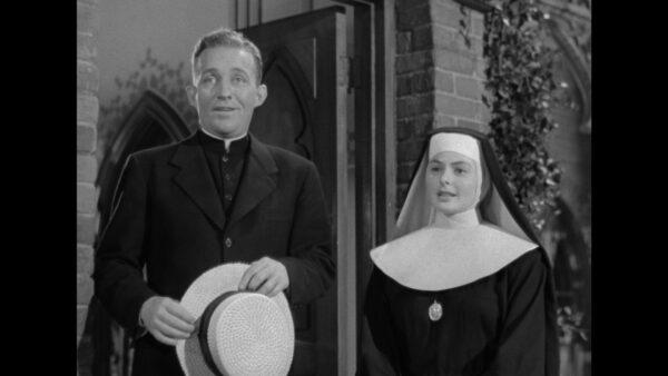 Bing Crosby as Father O'Malley and Ingrid Bergman as Sister Benedict look over St. Mary's grounds in "The Bells of St. Mary's." (RKO Pictures)